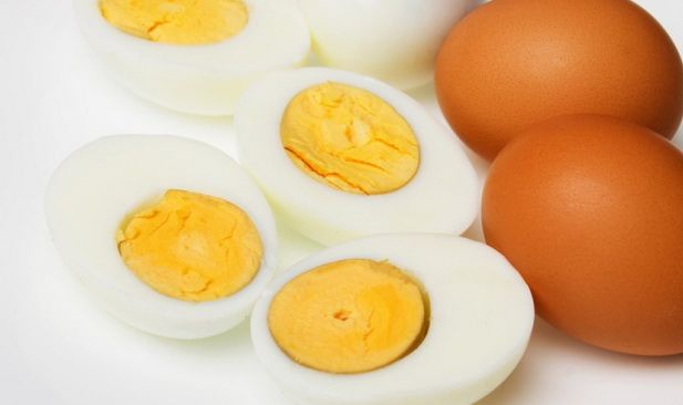 Hard boiled chicken eggs over white background, not isolated